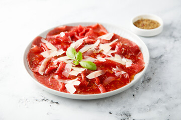 Traditional beef carpaccio with parmesan cheese