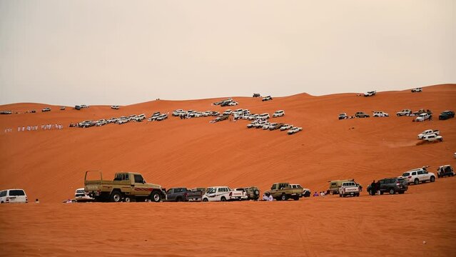 Riyadh, Saudi Arabia &ndash; November 1st 2023: Offroad vehicles bashing and climbing desert safari dunes ,red sand dunes adventurous ride 4x4 vehicle in Riyadh. Modified car, customized vehicle