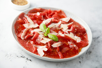 Traditional beef carpaccio with parmesan cheese