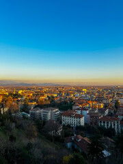 Fototapeta na wymiar Aerial view of the city of Bergamo at sunset. Bergamo alta, Italy. Vertical shot