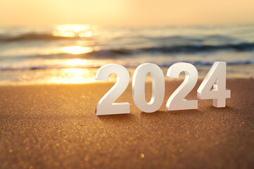 Year 2024 numbers placed on the beach. Start the new year on the beach in the morning and get ready...