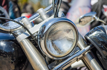 chrome shiny chopper motorcycle headlight closeup