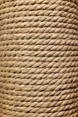 Jute rope in a skein close-up. Background of natural organic threads. Environmentally friendly Material for creativity. Made from the Corchorus capsularis plant. Scratching pad for a cat.