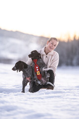 Christmas Joy: Girl and Puppies Frolicking in the Snow