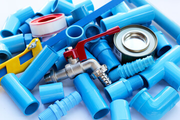 Plumber equipment with blue pvc pipe connections for plumbing work.