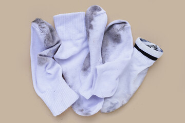 Dirty white socks on blue background.