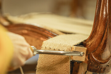 close up of a upholstery reparation in a small private own studio 