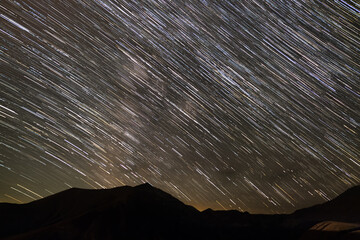 Star tracks  over mountain range.