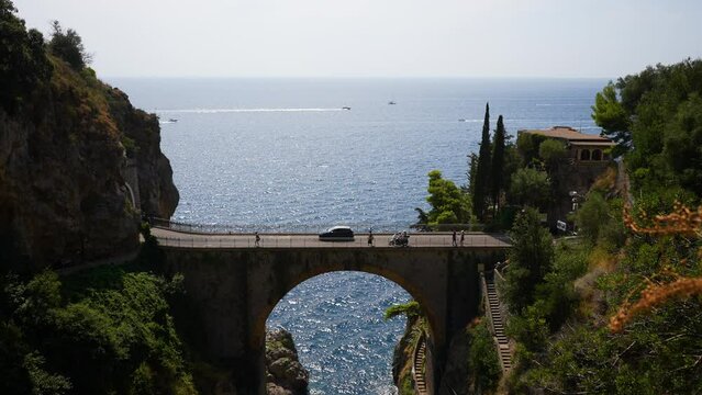 Scenery view of Fjord Furore Bridge and Mediterranean sea, unusual beautiful hidden place in province of Salerno in Campania region, on sunny summer day. Shooting in slow motion.