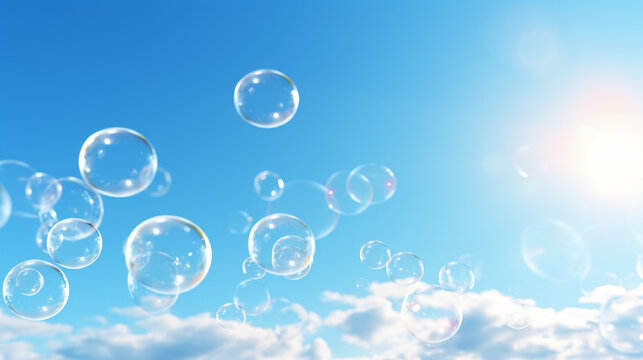 Soap bubbles on a blue sky illuminated by the sun texture background with copy space stock photo