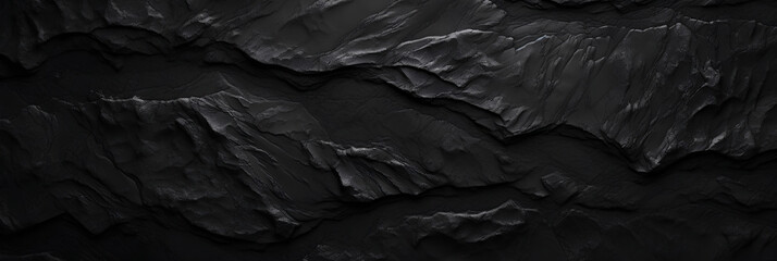 Wide black stone background banner wallpaper design. Dark rock grunge texture. Mountain surface close-up cracked empty copy space