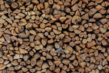 Background with ends of stacked firewood - 696851204