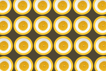 Pattern with a paraffin yellow twisted candle top view	