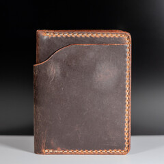 Classic Men's Wallet in Rich Brown Leather. Standing on the table.