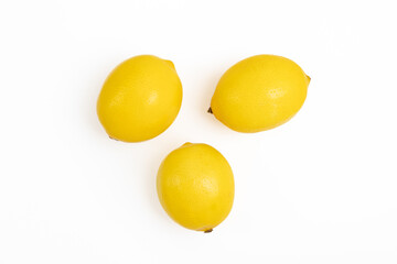 Three yellow lemons isolated on a white