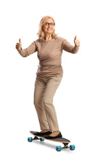 Mature woman riding a skateboard and getsuring thumbs up