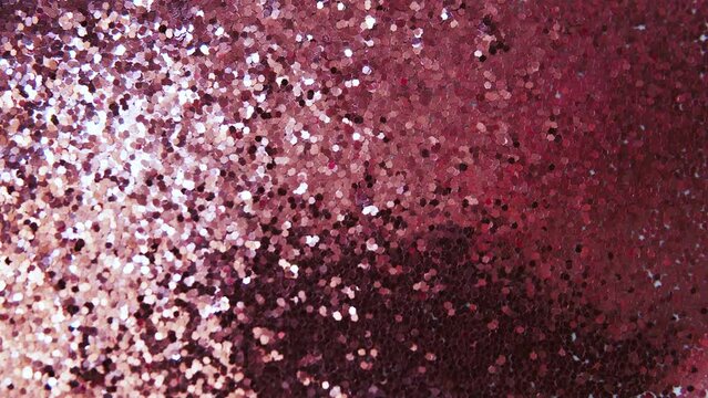 Red metal. Valentine's Day. Colorful particles such as confetti or sparkles. Red holiday background. Shiny texture. Particle background. Shining sparkles.  