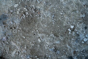 dry road with dirt sand and small stones pebbles