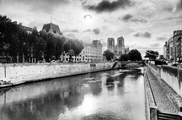 Notre-Dame cathedral and Seine river quay in the 6th arrondissement of Paris city - obrazy, fototapety, plakaty