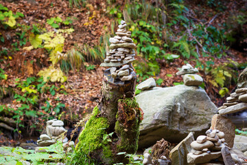Balanced pebbles near the mountain creek. Traditional meditation practice at the wild nature. - 696876002