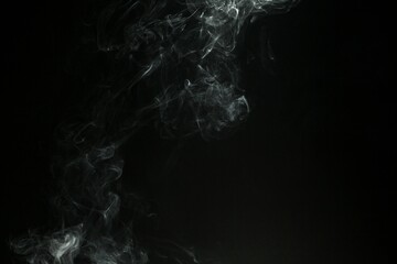 Abstract smoke misty fog on isolated black background. Texture overlays. Design element.
