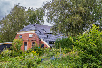 Old farm in village Mensingeweer municipality Het Hoge Land in Groningen province in The Netherlands