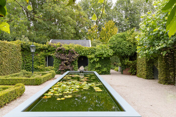 Houwerzijl, The Netherlands - August 10, 2023: Garden of Tea factory with fountain tea pot in...