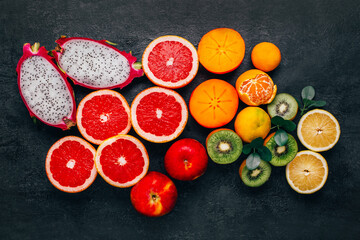 top view of citrus fruits on black background