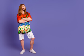 Full length photo of good mood guy dressed print shirt hands crossed look at promo empty space isolated on violet color background