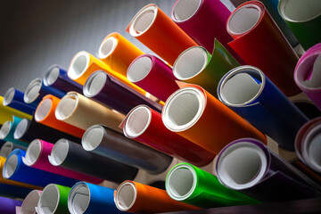 Rolls of multicolored vinyl film for detaling and car tuning. Sale of self-adhesive film from a...