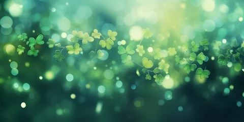 Poster Abstract decorative festive green background with a bokeh effect with three-leaf and four-leaf clover for St. Patrick's Day. © Vadim