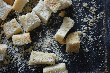 Delicious, dried fresh white bread, golden croutons in the form of delicious cubes, and golden dried breadcrumbs.
