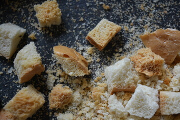 Delicious, dried fresh white bread, golden croutons in the form of delicious cubes, and golden dried breadcrumbs.