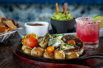 Grilled Octopus with Potatoes and Tomatoes