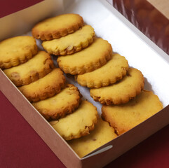 Classic round shortbread cookies in a box. Close-up