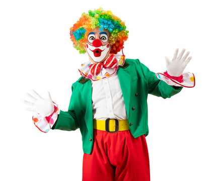 Funny clown. Entertainer Joker in a colorful suit and wig. Buffoon with clown whiteface makeup. Trickster, jester, pantomime, mime. Professional actor at event, kids party, circus