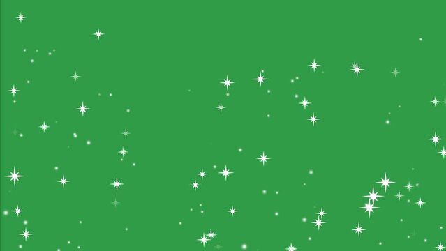 Descending radiant star sparkles over a green screen with alpha transparency