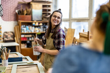 Female carpenter working in her workshop
