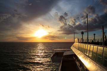 Sunset view from the open deck of the cruise ship. Cruising on a cruise ship by sea