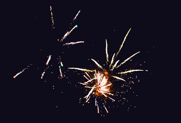 Fireworks set off on New Year's Eve on dark sky - obrazy, fototapety, plakaty