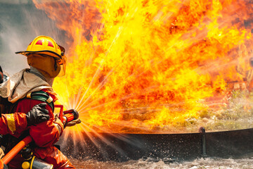 firefighter train fireman team extinguish spraying fire gas explosion. Fire fighter learning stop...