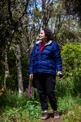 Young woman exploring the nature of a beautiful paramo at the department of Cundinamarca in Colombia