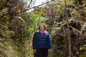 Young woman exploring the nature of a beautiful paramo at the department of Cundinamarca in Colombia