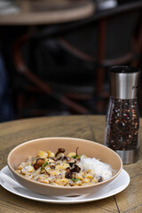 Pappardelle pasta with mushrooms and parmesan cheese on a plate . Traditional Italian gnocchi pasta with mushroom and parmesan cheese