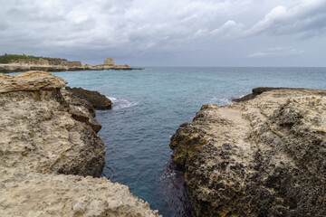Fototapeta na wymiar Grotta della Poesia coast cliff, Salento, Apulia, Italy