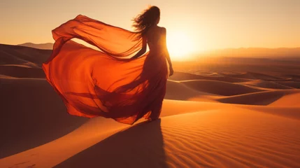Gartenposter young woman in silk dress on desert dunes © Natalia Klenova