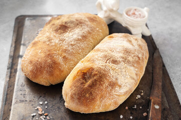 Homemade ciabatta, Homemade bread on a metal baking tray. Homemade ciabatta bread using whole wheat rye flour and sourdough starter