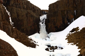 Fototapeta na wymiar Fardagafoss is a waterfall located just outside of Egilsstaðir on the route towards Seyðisfjörður town