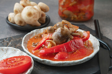 Lecho made of peppers, tomatoes and honey fungus mushroom. Home cooking for winter. Cold appetizer....