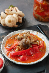 Lecho made of peppers, tomatoes and honey fungus mushroom. Home cooking for winter. Cold appetizer. Preparation for cooking the first course